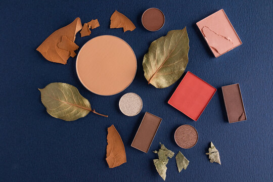 Autumn makeup collection with dry powder and fallen leaf