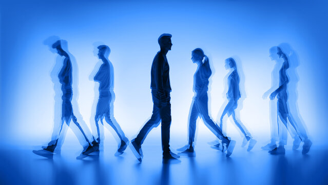 Blue motion blur of people walking in a busy urban area
