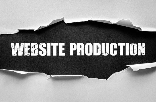 Torn paper effect revealing the words WEBSITE PRODUCTION in bold distressed font. Concept of web design, development, online presence, digital business, creative process, and internet technology