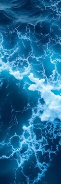 Turbulent ocean surface with a burst of bright blue water and foamy crests forming a dramatic wave shape, water, ||ocean