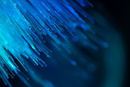 Blue fiber optic strands for digital technology background