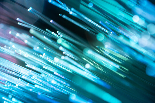 Fiber optic light trail technology background in blue hues