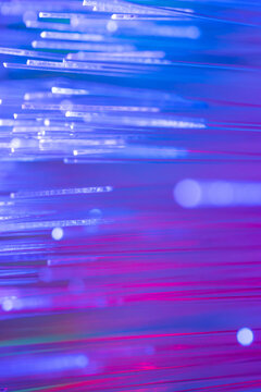 Fiber optic technology background with blue and magenta light