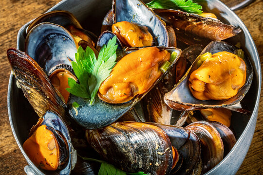 Traditional moules-frites with steamed mussels and herbs