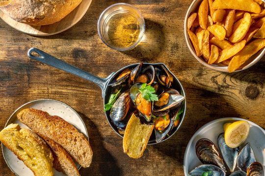 Traditional moules-frites with mussels, fries and white wine