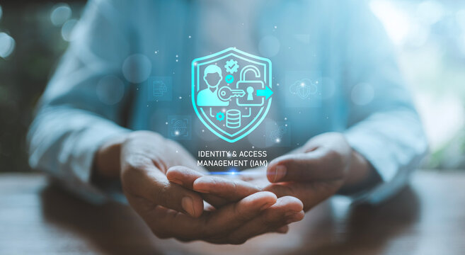 Identity and Access Management IAM concept person holding digital hologram shield user lock key gear and database for cyber security authentication access control policy and secure data protection