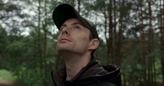 Young hiker exploring wild woods on overcast day close up shot