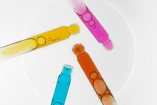 Colorful serum pipette with cosmetic face care oil