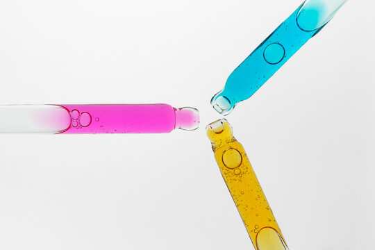 Colorful serum pipettes with cosmetic face care oil