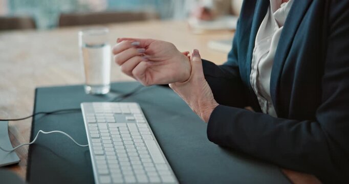 Laptop, hands and business woman with wrist pain in office for muscle tension, pressure or overworked. Deadline, female analyst and finance report with inflammation, carpal tunnel or joint ache