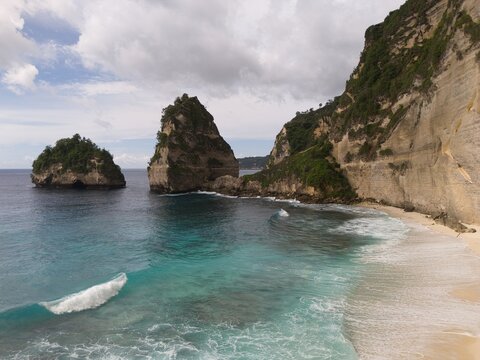 Dramatic sea stacks and limestone cliff at Bali beach