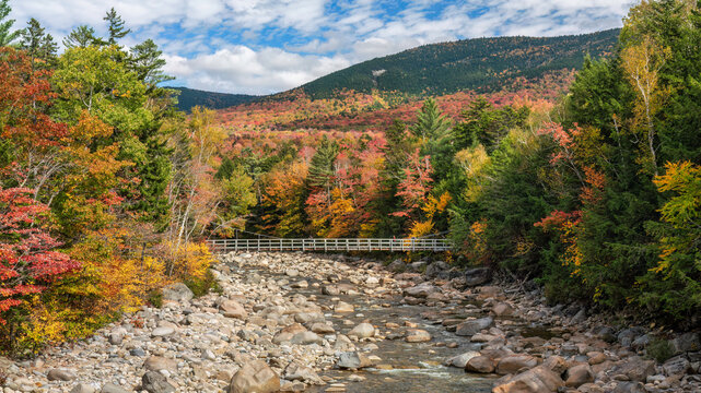 Autumn colors on the Lincoln Woods Trail over the Pemigewasset River taken from the Kancamagus Scenic Highway - New Hampshire