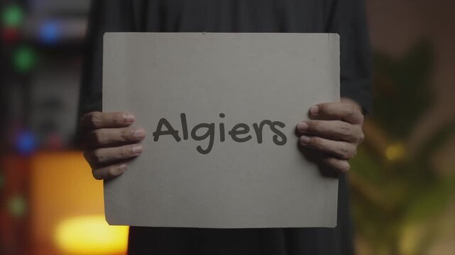 Algiers Written on Banner &ndash; Man Holding Placard