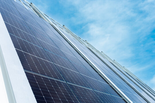Solar panel array under blue sky for renewable energy