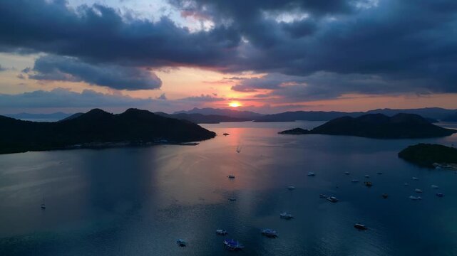 Coron Islands sunset with boats on tranquil water. Perfect aerial view drone
