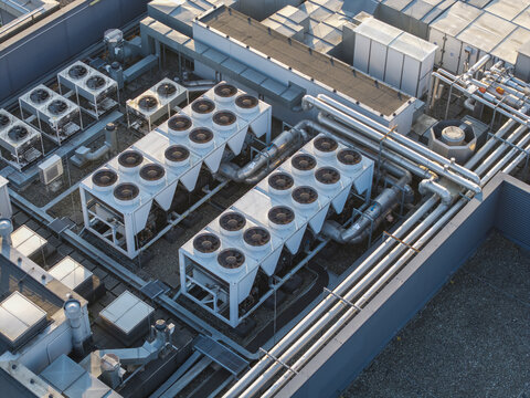 Aerial view of an AI data center cooling system with industrial ventilation fans and metal piping on a rooftop in Krakow, Lesser Poland Voivode, Poland.