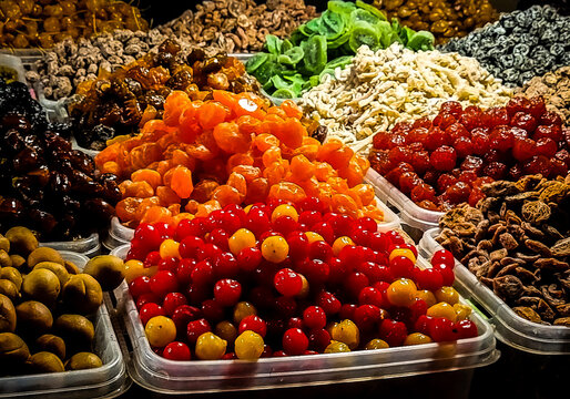 Colorful dried and candied fruits displayed at an Asian market stall