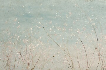 Obraz premium Delicate wildflowers against a soft blue sky.