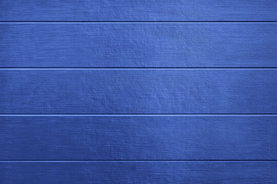 Realistic photo of painted wooden wall texture isolated background navy blue color horizontal grooved panels rustic surface natural timber pattern decorative backdrop copy space