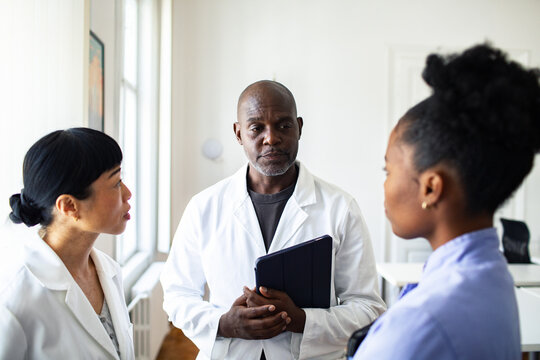 Medical team discussing treatment plan in clinic