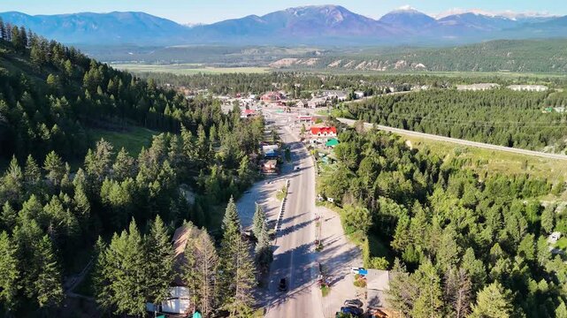 Wide aerial panorama of Radium Hot Springs on a clear sunny