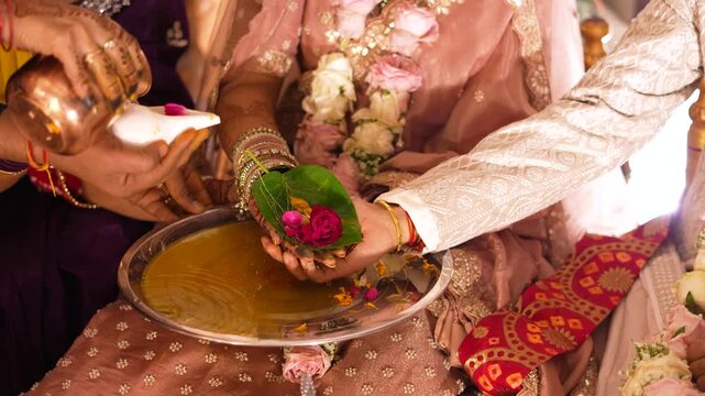 Traditional Indian Wedding Ritual with Water and Flowers