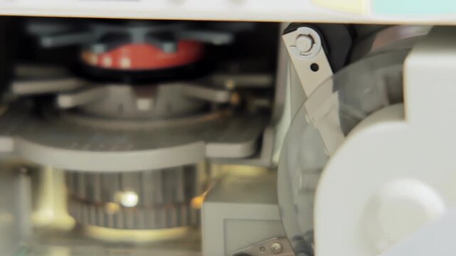 Close Up Shot of Researcher Adjusting Focus Wheel on Microfilm Reader - 4K