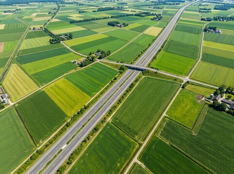 Aerial view of a highway passing through agricultural fields