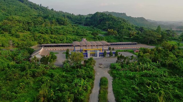 Aerial view of Kalan Circuit surrounded by lush green hills and tropical vegetation in Samarinda, East Kalimantan, Indonesia.