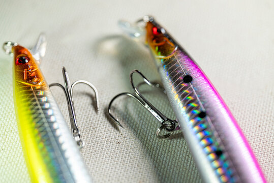 Artificial minnow lures with metal hooks on canvas The Concept of predator fishing and lure
