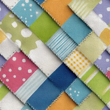 Seamless patchwork fabric background featuring multicolored quilt blocks with stripes, dots, and gingham patterns, showcasing a bright handmade textile design aesthetic