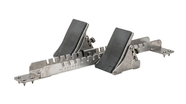 Professional track starting blocks, adjustable metal athletic equipment for sprinters, silver steel racing blocks isolated on white background