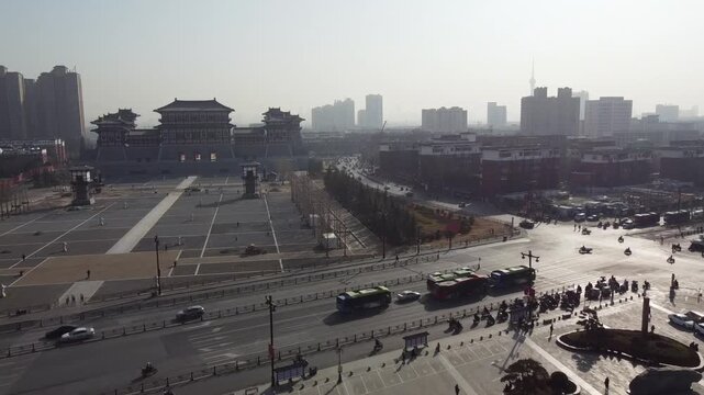 Aerial view of Lijingmen Gate with historic architecture and surrounding city streets in Luoyang, Henan, China.