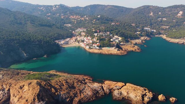 Aerial view of the rocky coastline and turquoise waters of the Mediterranean Sea near the town of Begur, Catalunya, Spain.