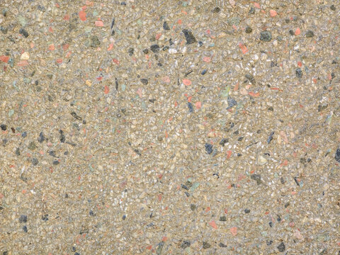 Recycled paper texture background with colored flecks and rough fibrous surface pattern