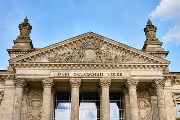 Fototapeta premium Reichstag facade with Dem Deutschen Volke inscription in Berlin