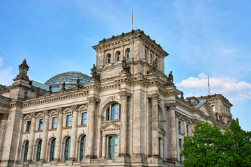 Fototapeta premium Reichstag building with glass dome under blue sky in Berlin
