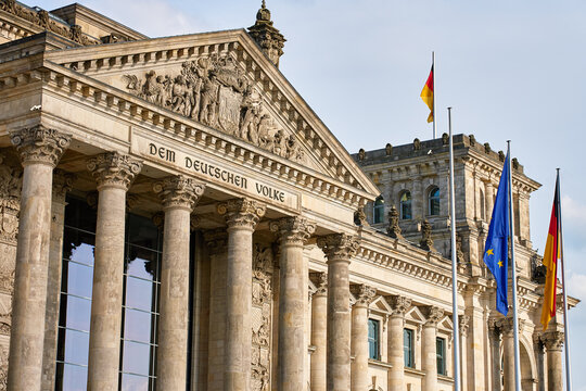 Reichstag building with German and European Union flags in Berlin