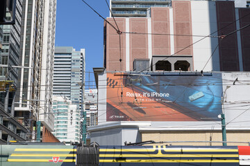 Fototapeta premium Apple Inc mural advertising at southeast corner of Spadina Av and King St W, Toronto (Find My feature)