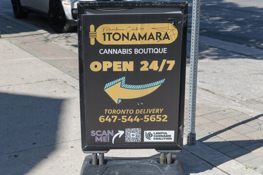 sidewalk sign outside 1Tonamara, a cannabis store, located at 202 Spadina Av, Toronto