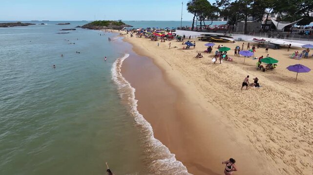 Aerial flyover of Sereia beach at Praia da Costa in Vila Velha Espirito Santo Brazil on a sunny day at noon