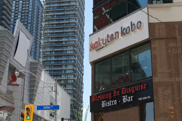 Fototapeta premium exterior building and sign of Rakuten Kobo, an e-commerce service, located at 150 John St, Toronto (with view of Scotiabank Theatre)