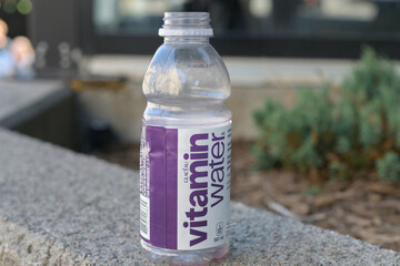 Fototapeta premium empty bottle of Glacéau Vitaminwater (a Coca-Cola brand) with purple and white label, Toronto