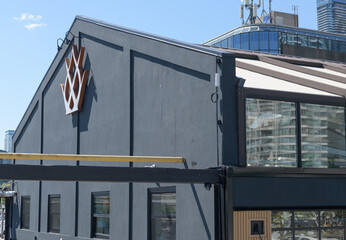 Fototapeta premium logo on the exterior of Queens Harbour, a restaurant, located at 245 Queens Quay W, Toronto