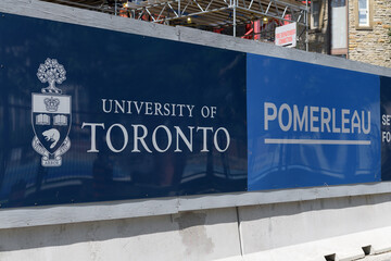 Fototapeta premium signage of University of Toronto and Pomerleau general contractor and construction manager of Academic Wood Tower