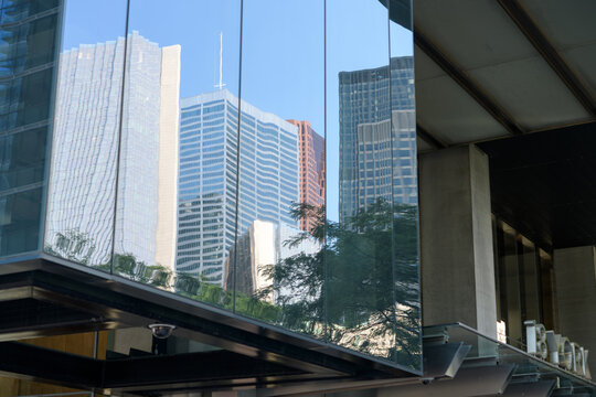 abstract and distorted building of Toronto's financial district on the windows of 18 York Street (PwC Tower)