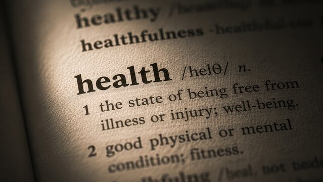 A health dictionary definition word printed on a paper page with macro focus.