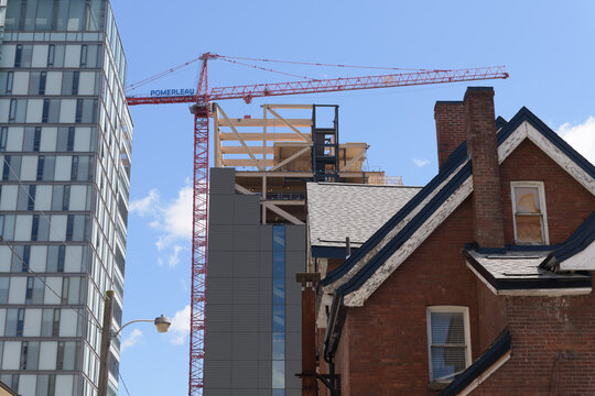 looking east on Lane South Bloor West St George to The Academic Wood Tower under construction and the rear of 160 St George St (historic house from 1895), Toronto
