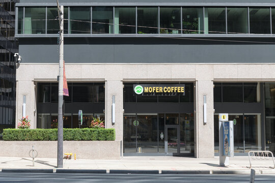 exterior building facade and sign of Mofer coffee located at 55 University Av, Toronto