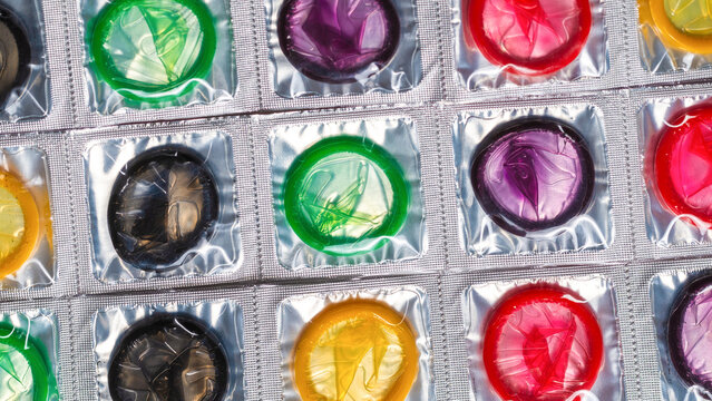 Colorful condoms background.